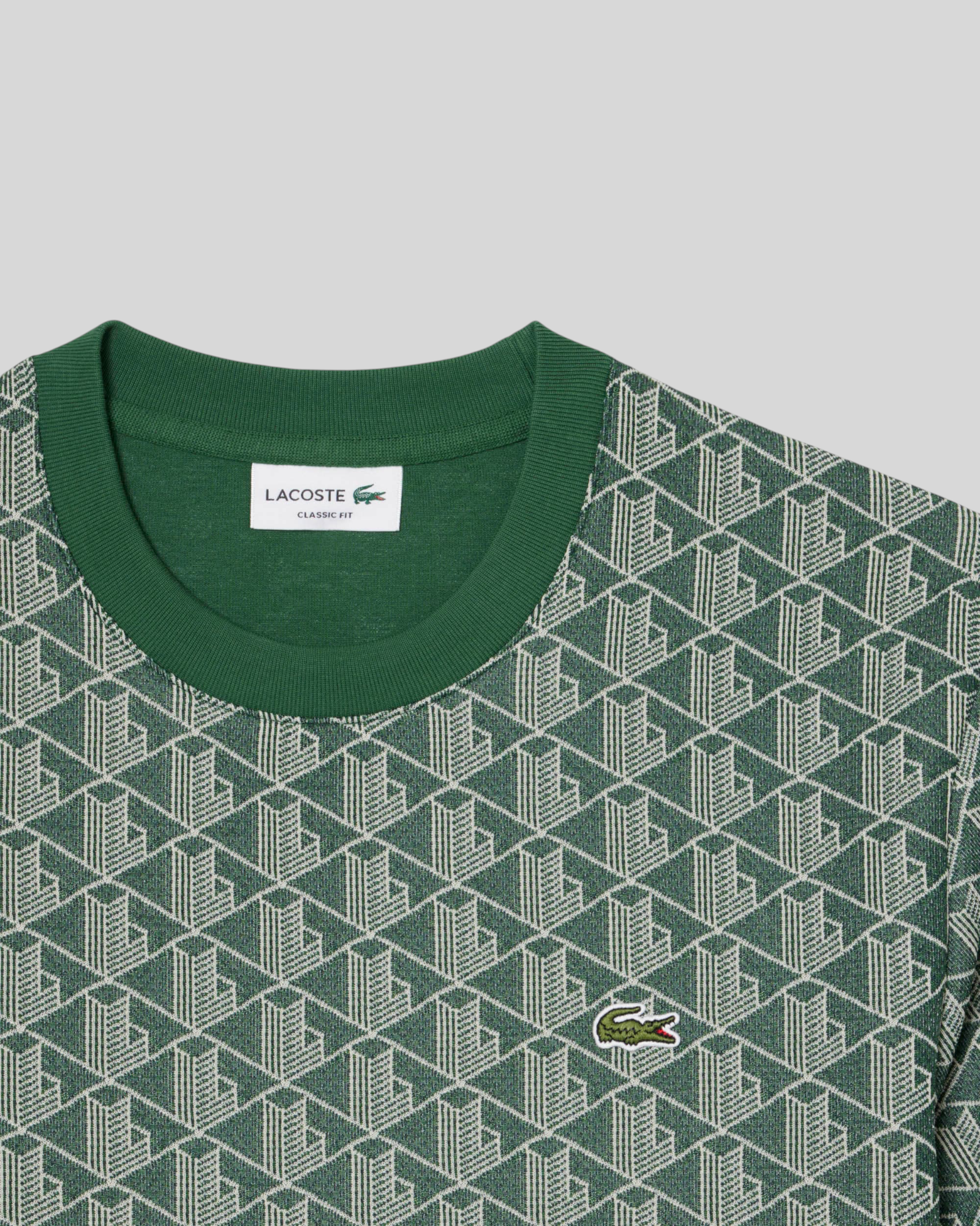 Brillantina Store green jacquard t-shirt with all-over monogram pattern and embroidered crocodile logo.