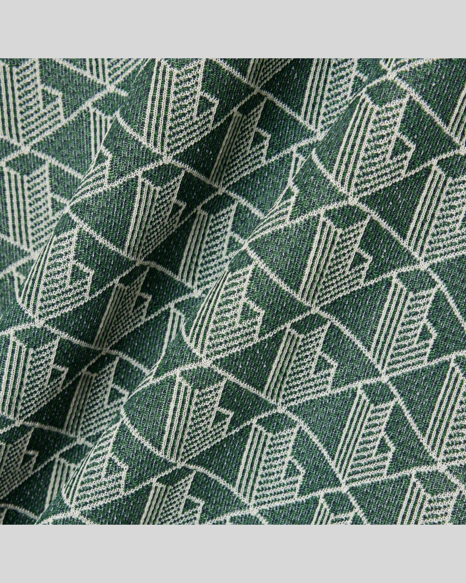 Brillantina Store green and white jacquard monogram t-shirt made from organic cotton and recycled polyester blend.