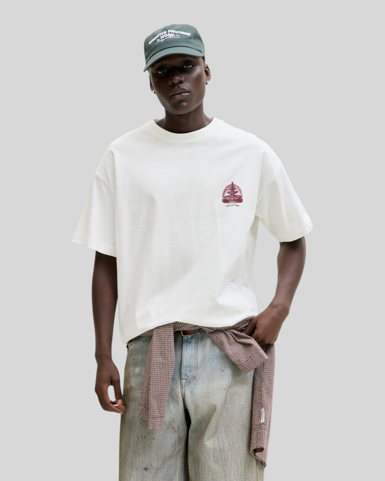 Brillantina Store white 100% cotton t-shirt with a round neck, short sleeves, and a small red graphic print on the front.